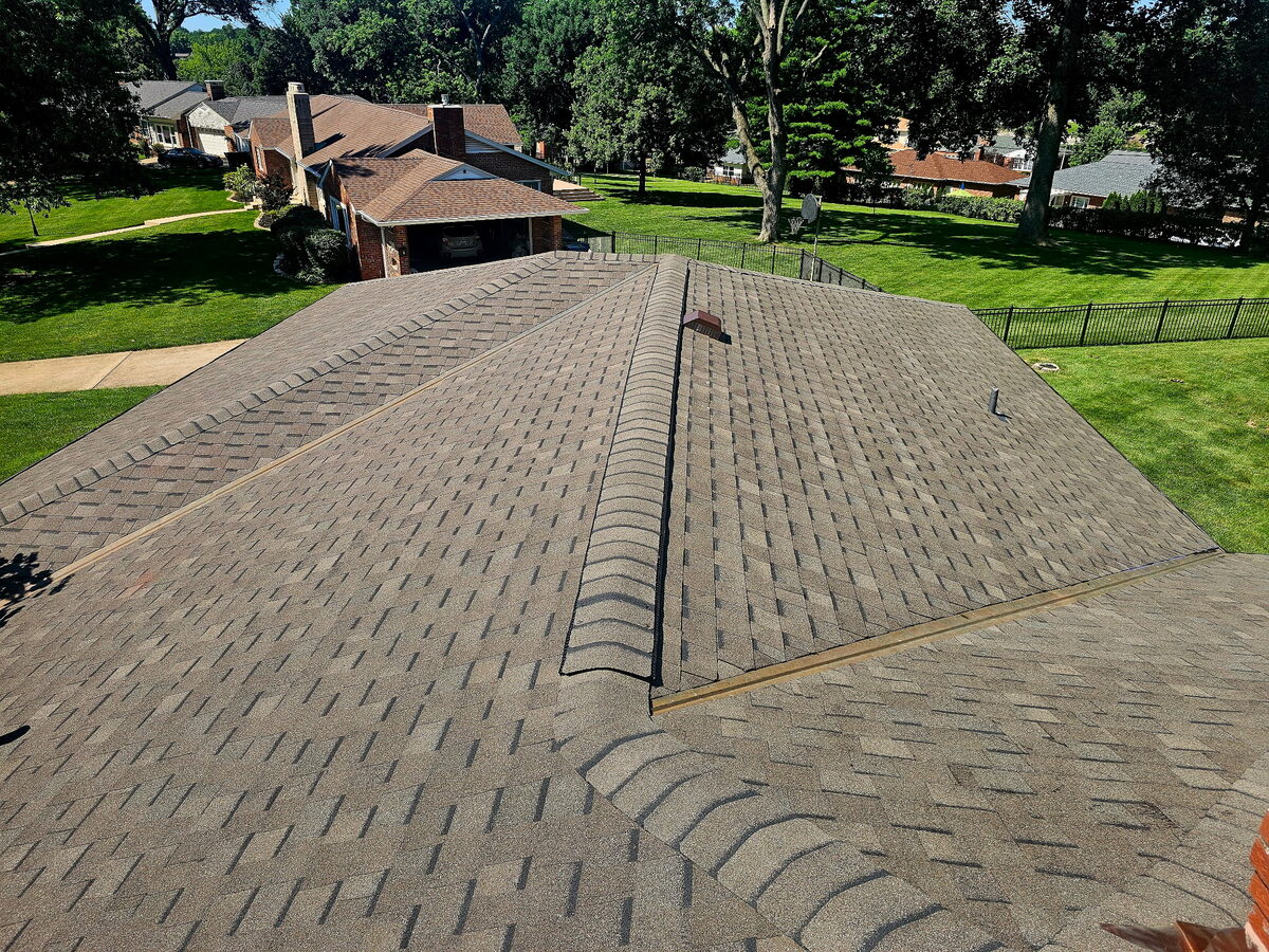 Architectural asphalt shingle roof showing clean, uniform installation on a St. Louis home
