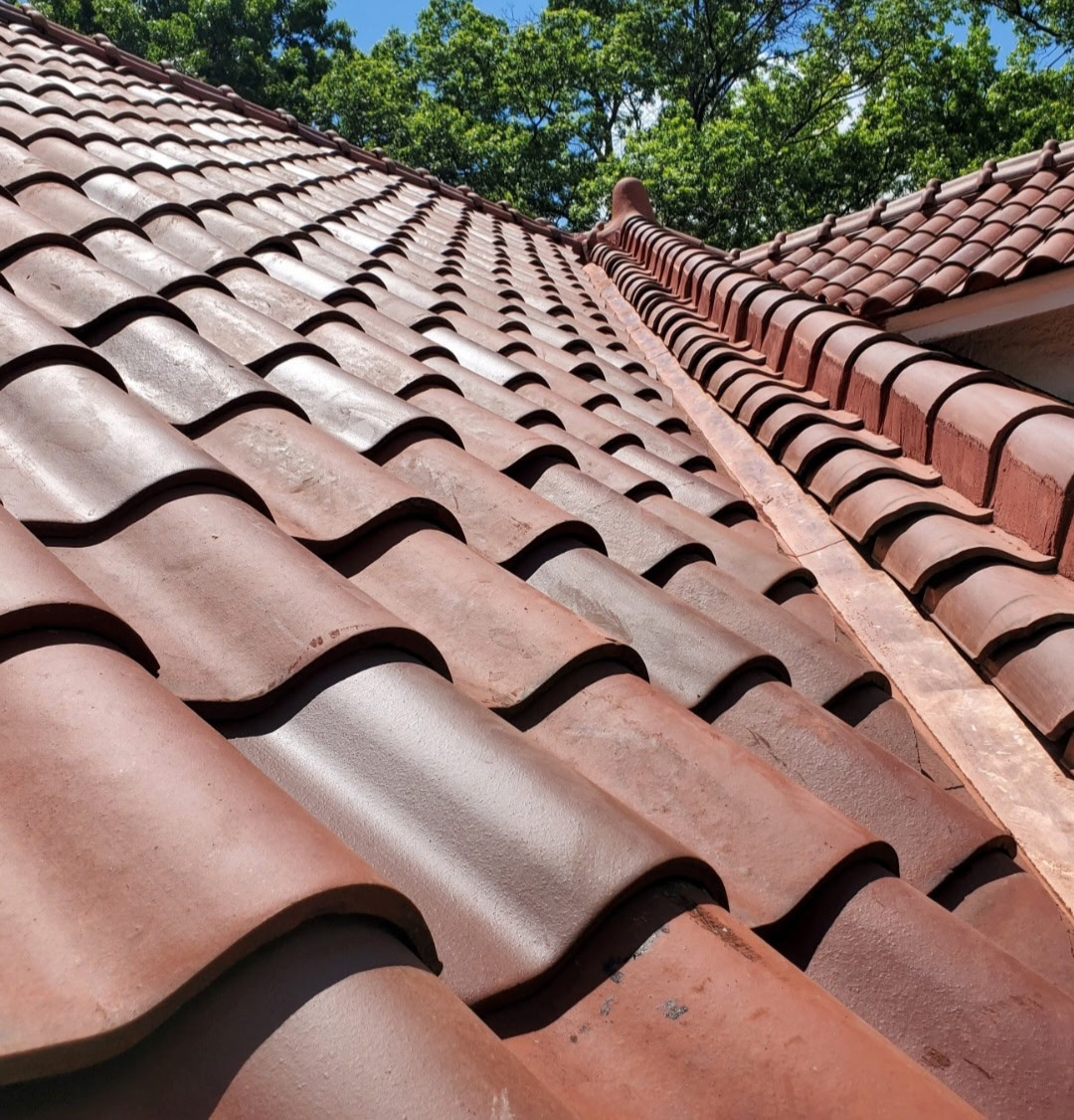 Clay barrel tile roof installation on a residential home