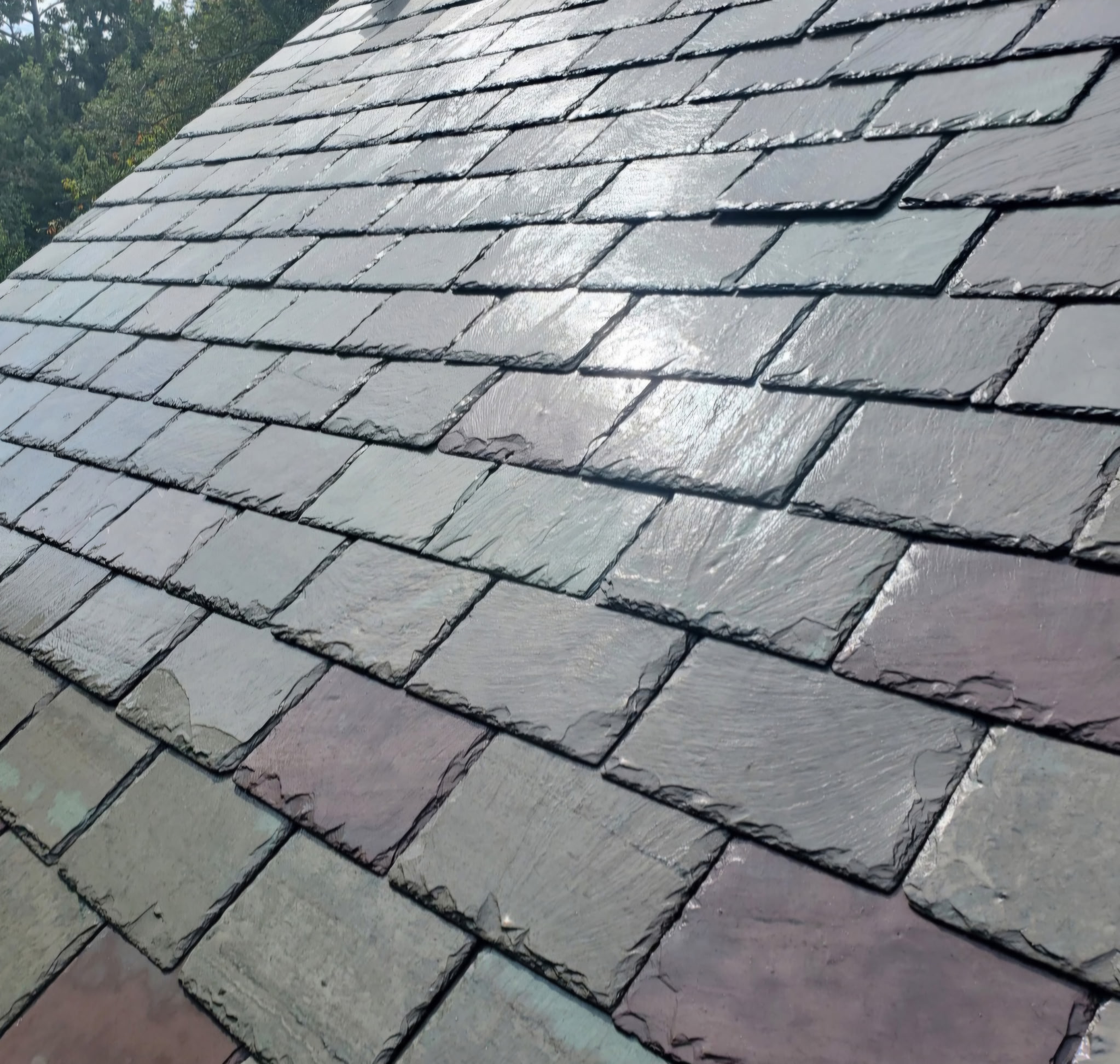 Natural slate roof installation showing multi-color slate variation on a St. Louis home
